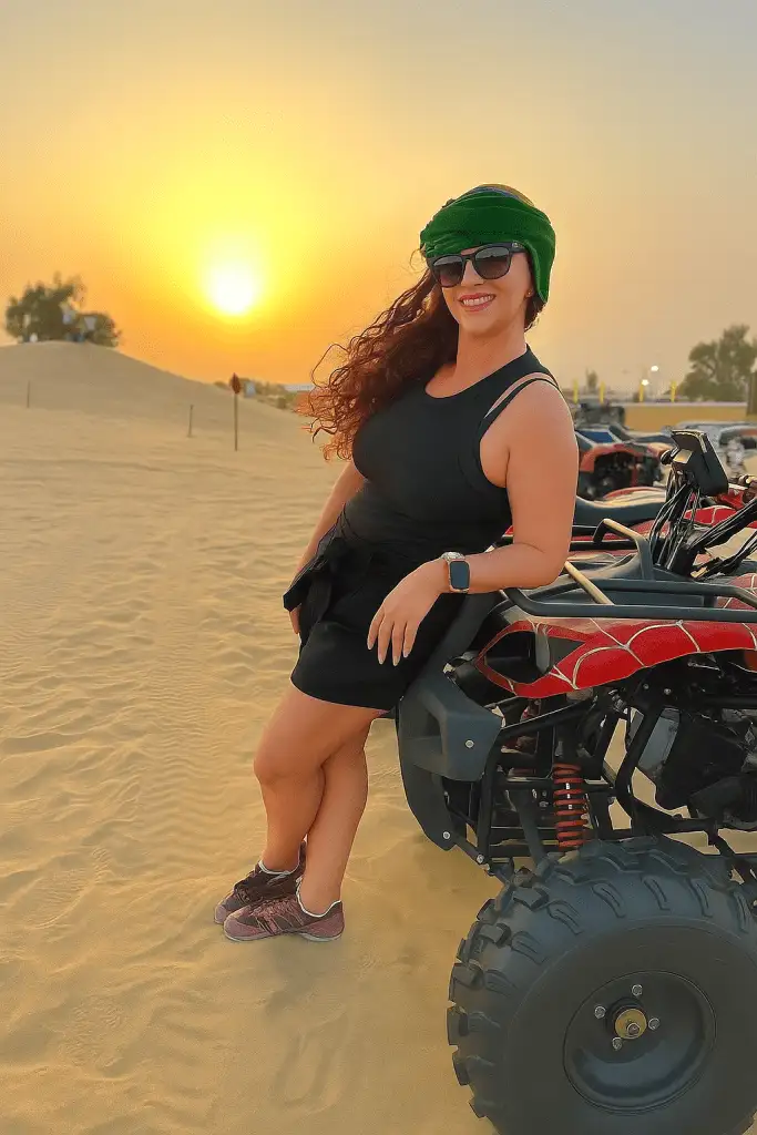 Scenic desert quad biking Dubai ride across red sand dunes.