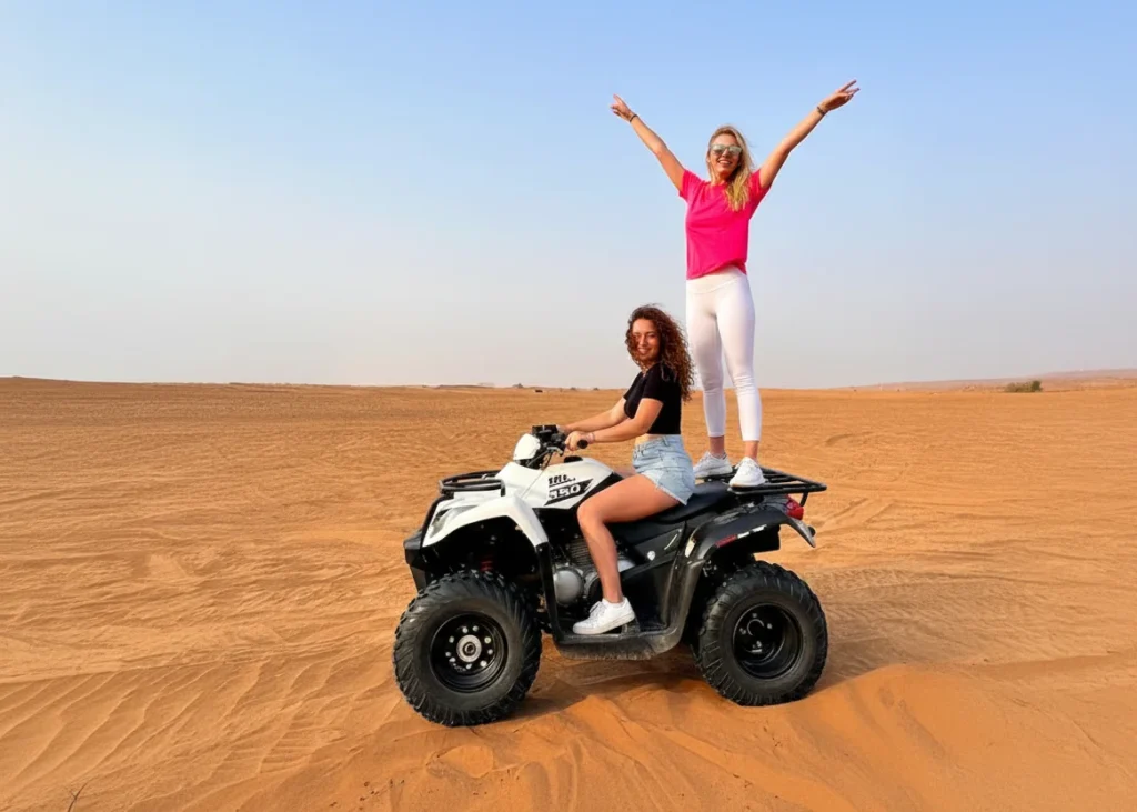 Child riding a small quad bike in a supervised flat desert area