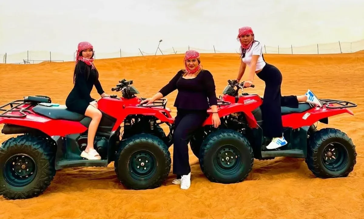 Group of riders enjoying Morning vs Evening Quad Biking Dubai together in Dubai desert