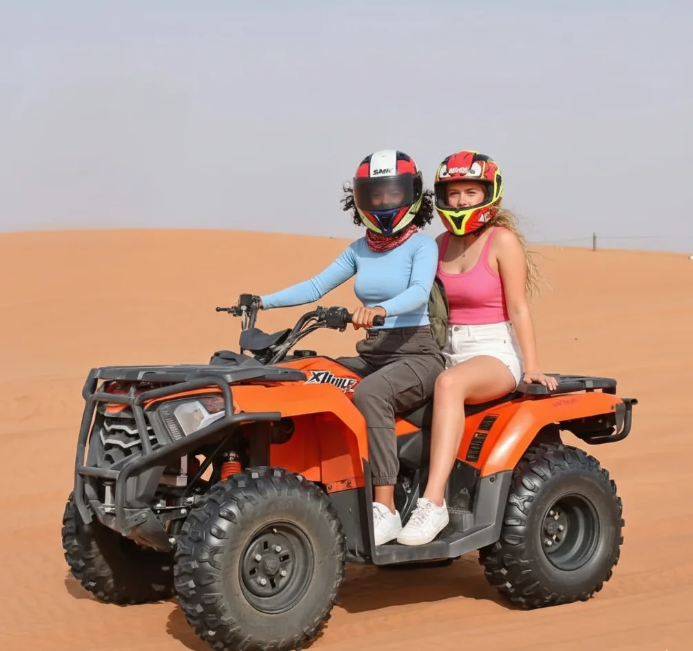 Group of riders following a guide across tall sand dunes in Dubai desert