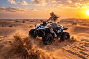 Rider navigating a quad bike across the red sand dunes of Dubai desert during a guided morning adventure under clear skies safely