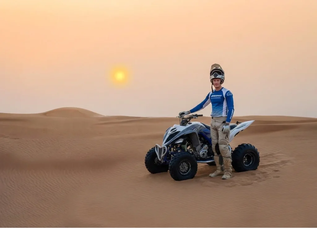 Instructor explaining throttle control and safety rules to riders before starting quad bike ride in Dubai desert training area