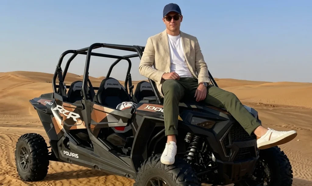 Multiple dune buggies following guide across Dubai desert dunes in safe convoy formation during professional guided adventure tour experience