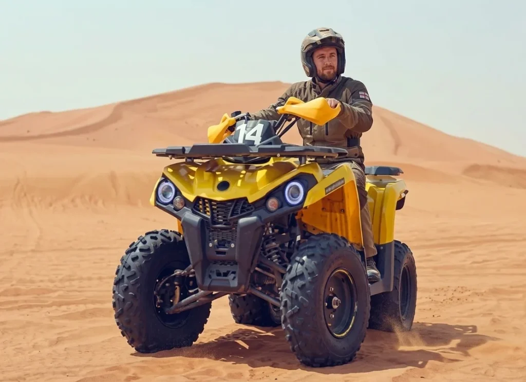 Guide explaining quad biking safety rules to tourists before riding ATV bikes in Dubai desert including helmet use riding controls and desert safety tips