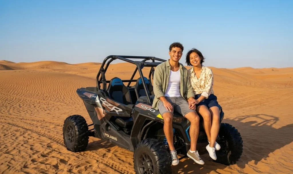 Powerful dune buggy climbing steep red sand dunes in Dubai desert, showing thrilling yet controlled off road adventure suitable for beginners