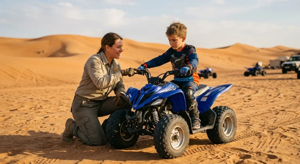 A parent helping a child wear a safety helmet before a kids quad biking adventure in Dubai during the summer holidays.