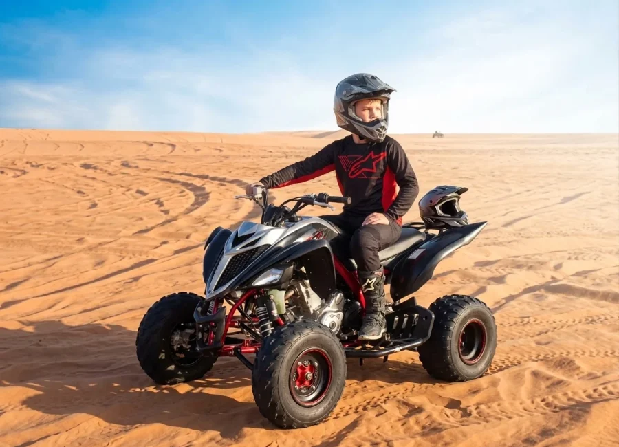 Kids quad bike riding tours across Dubai desert dunes